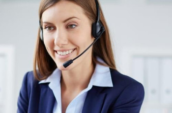Smiling secretary typing laptop 1